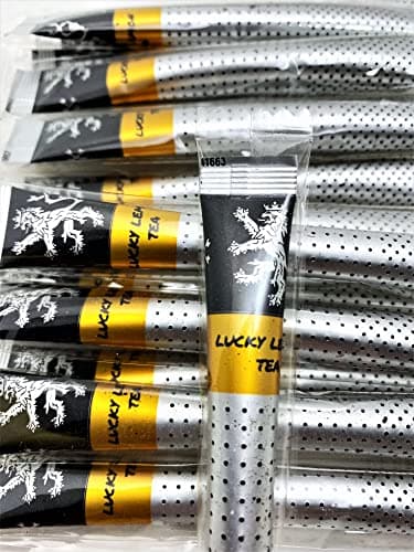 Lucky Lemon Tea — a close-up of wrapped sticks fanned out on a white background, one propped forward showing the gold 'LUCKY LEMON TEA' label